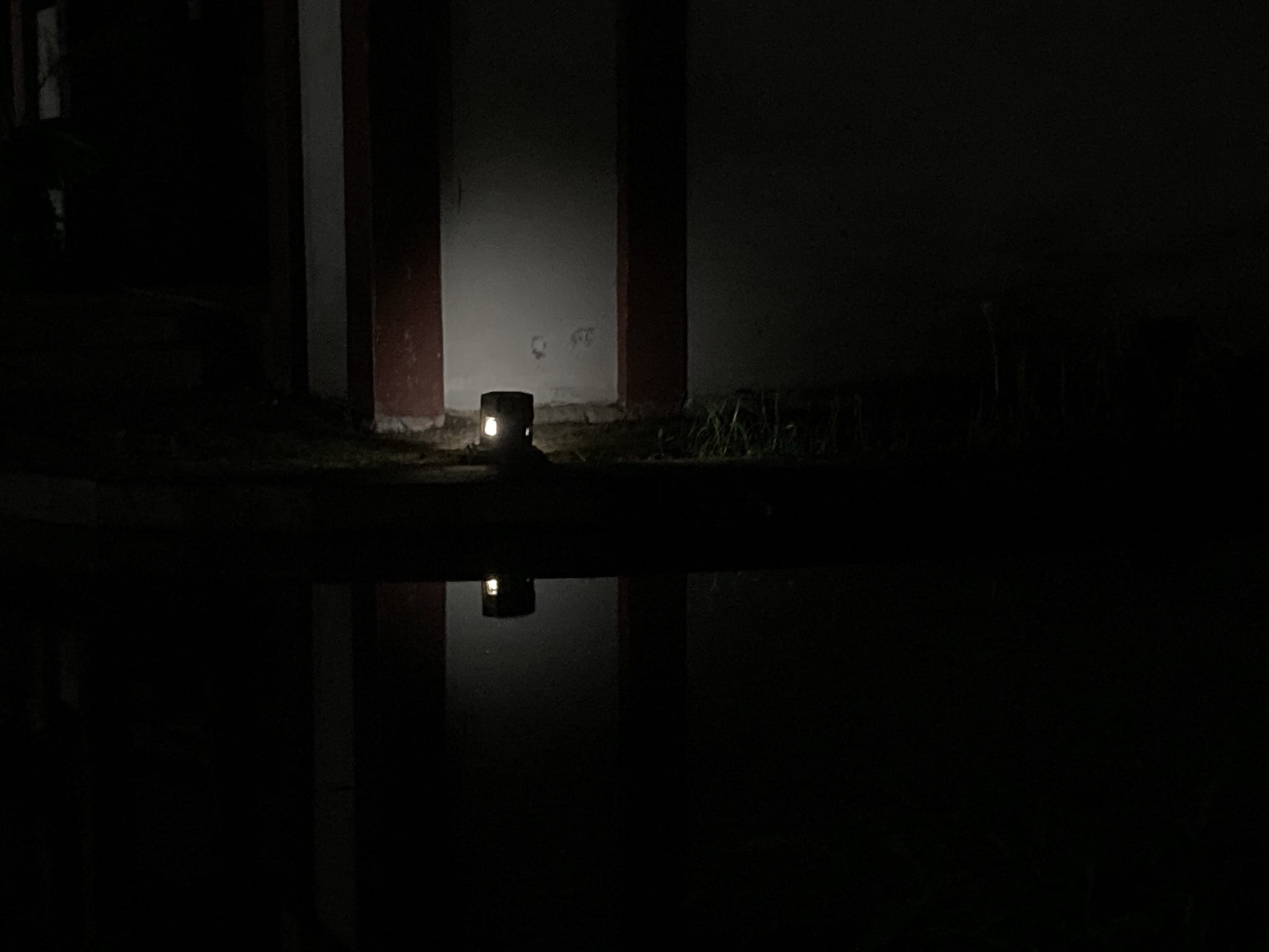 Light reflected in a lake at night.